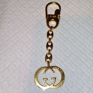 Gucci GG Interlocking Gold Tone Keychain Bag Charm